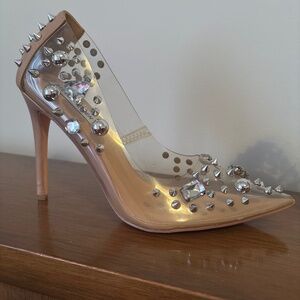 Clear and nude color pointed toe pumps